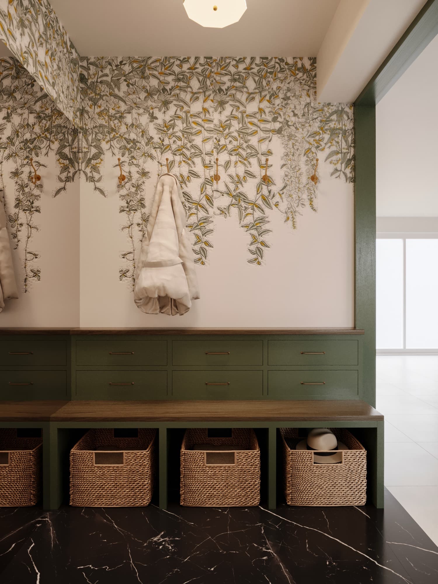 Entry mudroom in deep green joinery with botanical wallpaper and woven baskets